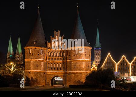 The Holsten Gate in Lübeck at night Stock Photo