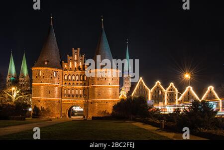 The Holsten Gate in Lübeck at night Stock Photo