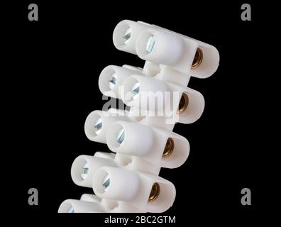 Electric connection strip with screws for cable splicing isolated on a black background Stock Photo