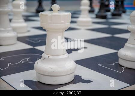 mannequins from chess game on black and white squares Stock Photo