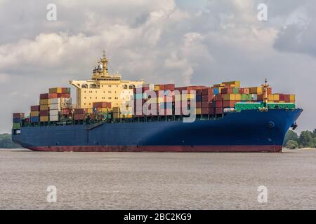 Container ship on the Elbe in the Hamburg port Stock Photo