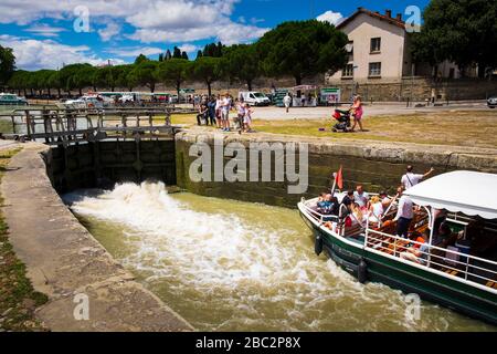 Boats passing the lock at the Pont Marengo  on the canal du Midi at Carcassonne Aude France Stock Photo