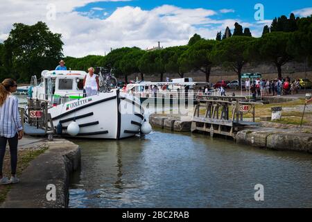 Boats passing the lock at the Pont Marengo  on the canal du Midi at Carcassonne Aude France Stock Photo