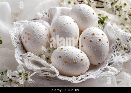 Handmade white Easter eggs decorated with wax Stock Photo