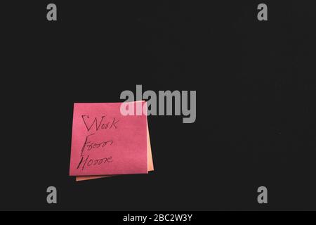 Working from home concept with  a sticky note with workfrom home written on black background, Sweden Stock Photo
