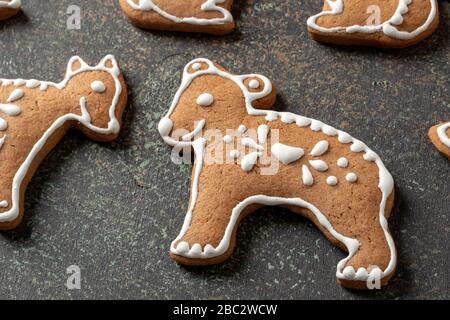 Homemade Christmas gingerbread cookies decorated with white icing Stock Photo