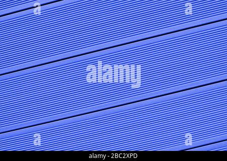 Vinyl siding texture, blue color. Modern plastic wall cladding protective material for houses and small apartment buildings. Wood clapboard imitation Stock Photo