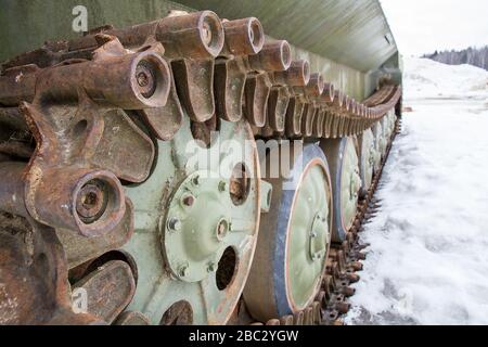 Old armored vehicle crawler suspension close-up. Stock Photo