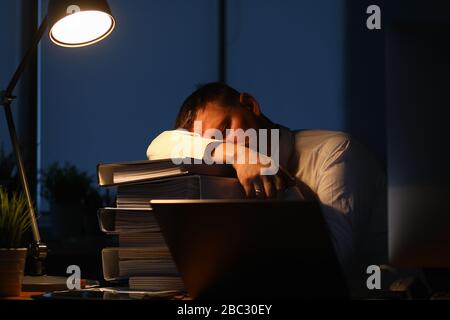 Tired male worker Stock Photo