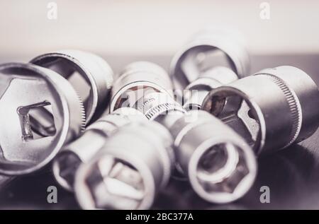 Socket wrenches isolated on wooden background Stock Photo