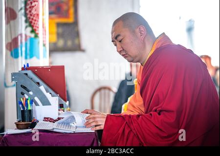 Naryn-Acagat temple, Ulan Ude, Siberia, Russia - March 09, 2020 : Buddhist monks are reading mantras in Dzogchen Duga. Buddhist monks are praying in a Stock Photo