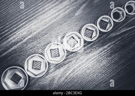 Socket wrenches on wooden floor Stock Photo