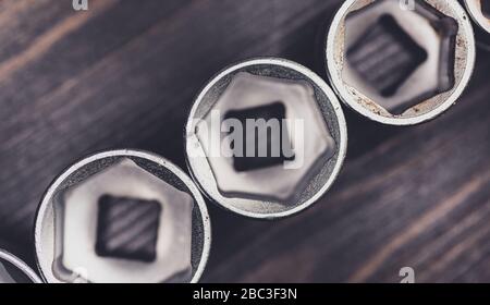 DIY tools - Socket wrenches on wooden worktop Stock Photo