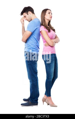 Unhappy couple standing back to back Stock Photo