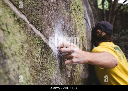 Close up of a rock climber hand on rock Stock Photo