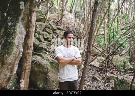 Upper part portrait of rock climber in a forest Stock Photo