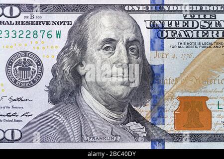 close up of the Benjamin Franklin portrait on the US 100 dollar bill Stock Photo