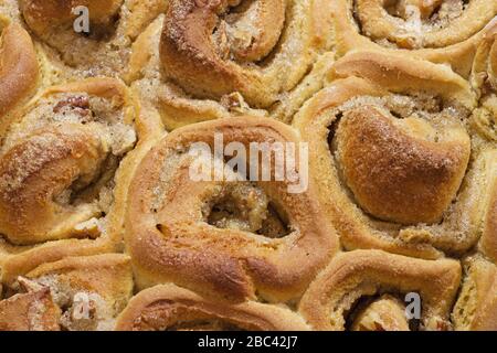 detail of a pan of homemade sticky bun rolls fresh out of the oven Stock Photo
