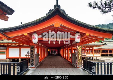 Itsukushima shrine pathway on stilts at Miyajima island, a famous Shinto shrine and UNESCO World Heritage Site, Japan Stock Photo