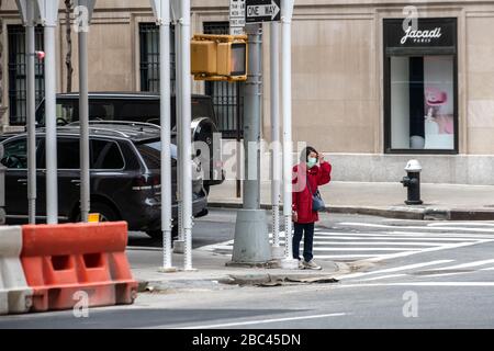 New York, USA. 2nd Apr, 2020. A woman wears a face mask as she walks in New York City. Today the government said that Newyorkers should cover their faces when they go outside, to prevent coronavirus spread. Credit: Enrique Shore/Alamy Live News Stock Photo