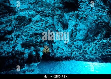 Bleu cave in Croatia, Croatian wonder, landmark. inside of the Blue cave, Bisevo island, light of blue color from water at midday Stock Photo