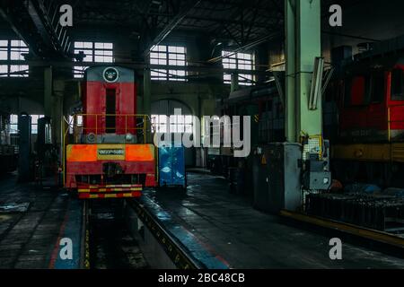 Old diesel locomotive at train depot. Stock Photo