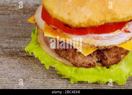 Appetizing juicy burgers with a cutlet, cheese, tomato Stock Photo