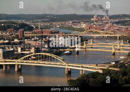 Bridges cross over the Allegheny River in the center of Pittsburgh, Pennsylvania, USA. The Fort Duquesne Bridge is in the foreground. Stock Photo