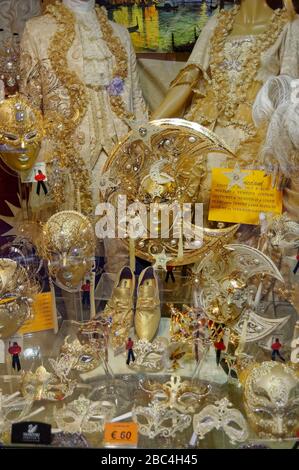 Golden festival masks in a shop window Stock Photo