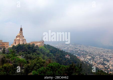 Basilica of Saint Paul sits on a hillside overlooking Beirut, Lebanon, Middle East, color.  Taken from Our Lady of Lebanon at Harissa. Stock Photo