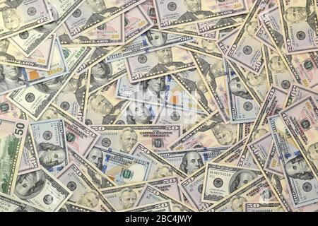 Many one hundred and fifty dollar bills on flat background surface close up. Flat lay top view. Abstract success or business concept Stock Photo
