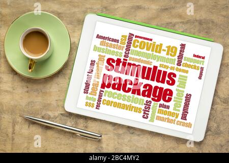 stimulus package word cloud on a digital tablet, relief bill during covid-19 coronavirus pandemic concept Stock Photo
