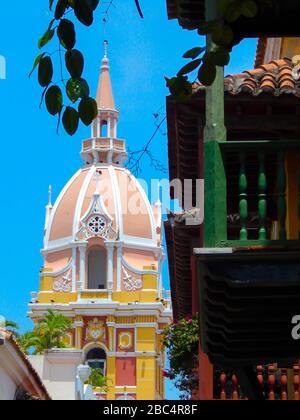 view of the cathedral and hanging plants on the balconies from a street in cartagena colombia Stock Photo