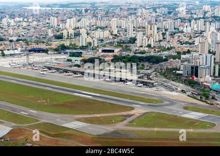 Aerial overview of Congonhas Airport two runways and passengers terminal. Central airport of Sao Paulo, Brazil used for domestic flights. Stock Photo