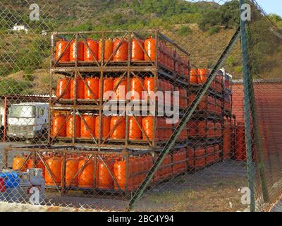 Alora, Spain - July 18. 2017: Butane gas bottles at depot in Andalusian countryside Stock Photo