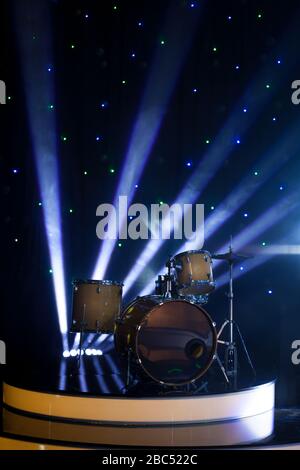 Modern drum set on stage  in the spotlight color prepared for playing Stock Photo