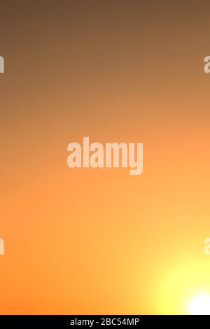 Color gradients from light to shadow from white to orange to grey. Stock Photo
