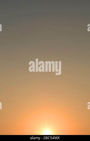Color gradients from light to shadow from white to orange to grey. Stock Photo