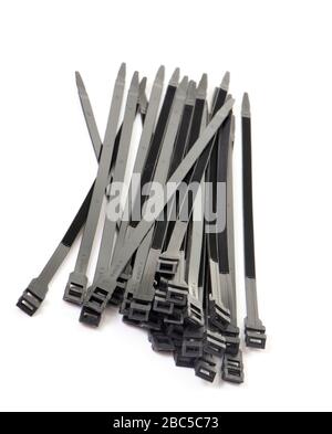 black cable ties in front of white background Stock Photo