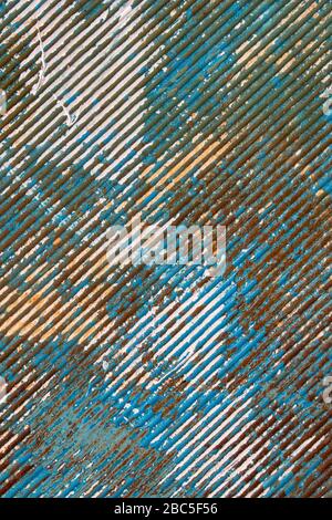 Peeling paint on rusty corrugated metal Stock Photo