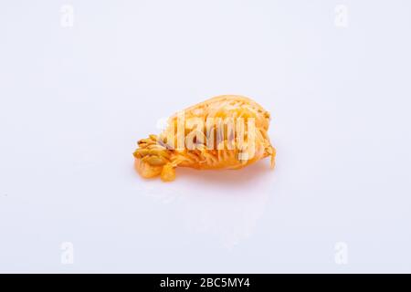 Melon seeds isolated in front of a white background Stock Photo