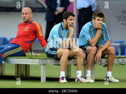 Spain's Pepe Reina (left) Cesc Fabregas (centre) and Gerard Pique (right) during training at the Olympic Stadium in Kiev ahead of their Final match against Italy tomorrow Stock Photo