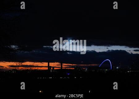 London, UK. 02nd Apr, 2020. The iconic Wembley Stadium arch lit up blue to celebrate frontline NHS workers as part of the Clap for Carers event. Credit: David Parry/Alamy Live News Stock Photo