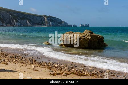 Low level view from Alum Bay beach acroos sand and shingle to the needles lighthouse Stock Photo