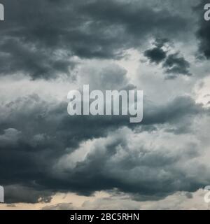 Dark sky with heavy stormy clouds - natural background Stock Photo