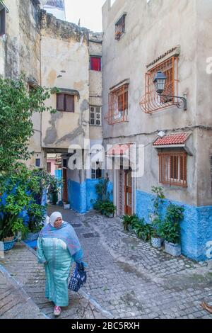 Tangier, Morocco, Africa: Moroccan woman in traditional clothes walks in the Medina. Stock Photo