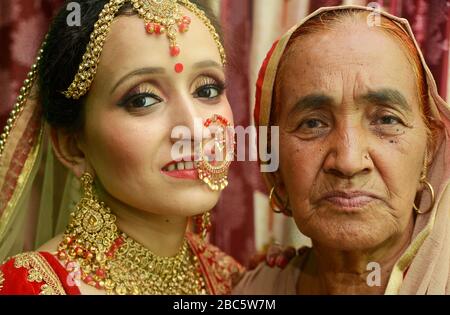 Grand mother blessing bride on wedding day Stock Photo