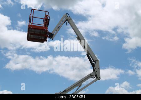 The Cage and Long Arm of a Cherry Picker Lift. Stock Photo