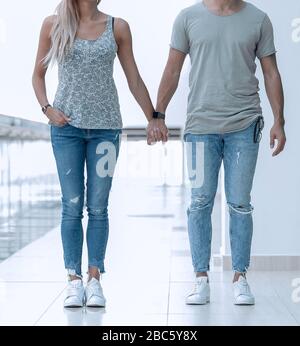 couple standing in the lobby of a modern building Stock Photo