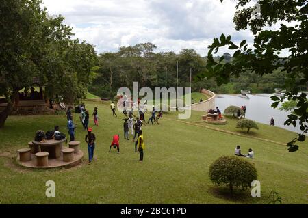 LILONGWE, MALAWI, AFRICA - APRIL 1, 2018: African teenagers are having party, jumping and dancing on the grass near Kamuzu Dam II. Stock Photo